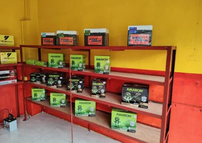 Shelves stocked with Amaron, DynaForce, and Yokohama car batteries at Jet Battery Trading store in Rizal