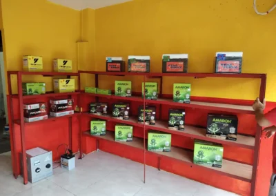 Wide view of Jet Battery Trading showroom with Amaron, Yokohama, Primera, and DynaForce batteries on display