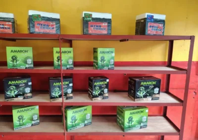 Battery display featuring Amaron and DynaForce brands in Jet Battery Trading branch with yellow and red walls