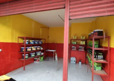 Inside Jet Battery Trading store showing both Amaron and Motolite battery shelves ready for customers